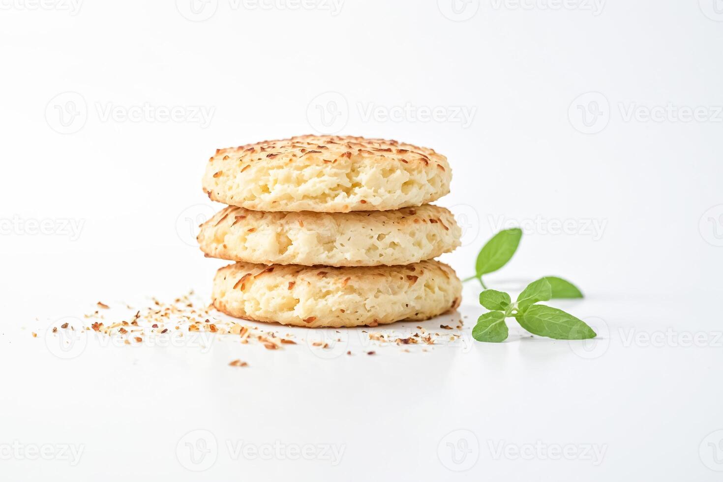 Stack of coconut cookies with basil leaves photo