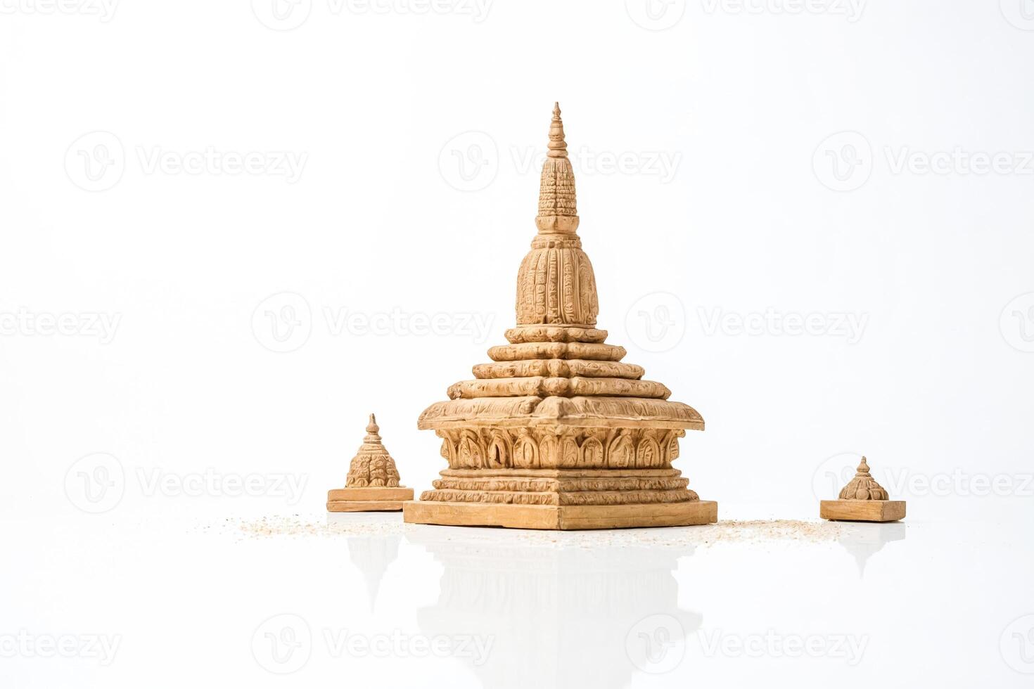 Wooden Miniature Pagoda Model with intricate carvings on a white background photo