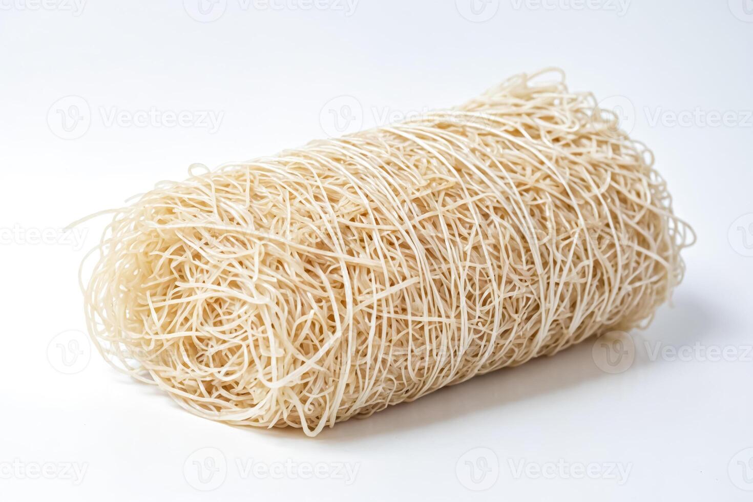 Culinary Essentials Dry Asian Noodles on a White Background photo