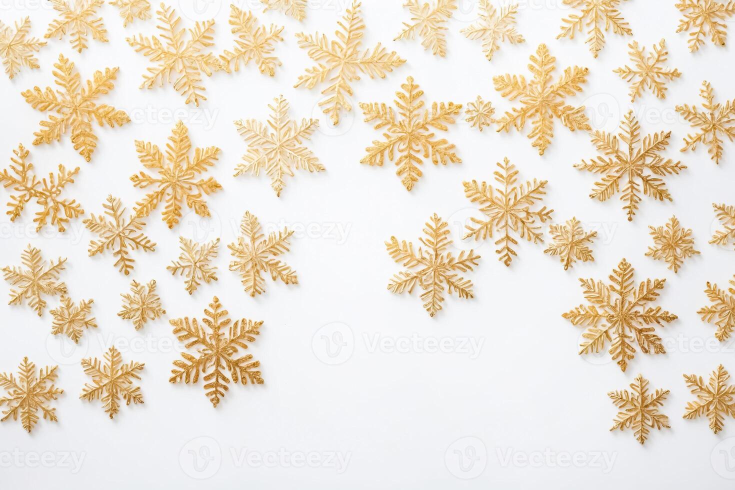 Golden snowflakes on white background photo