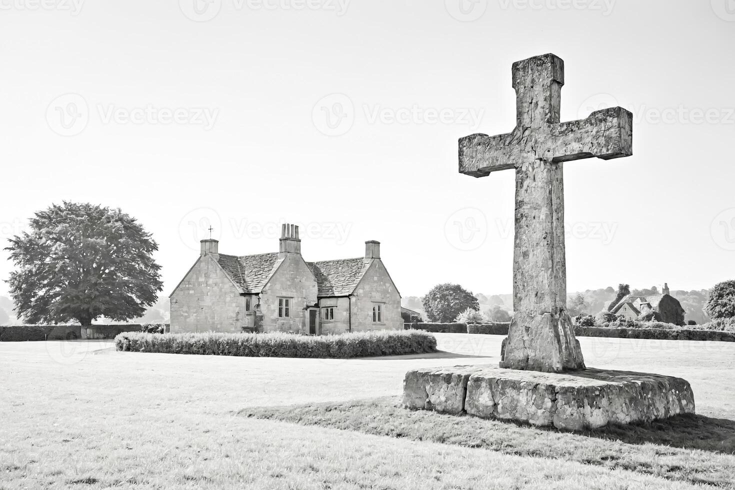 Stone Cross and Cottage in Black and White photo