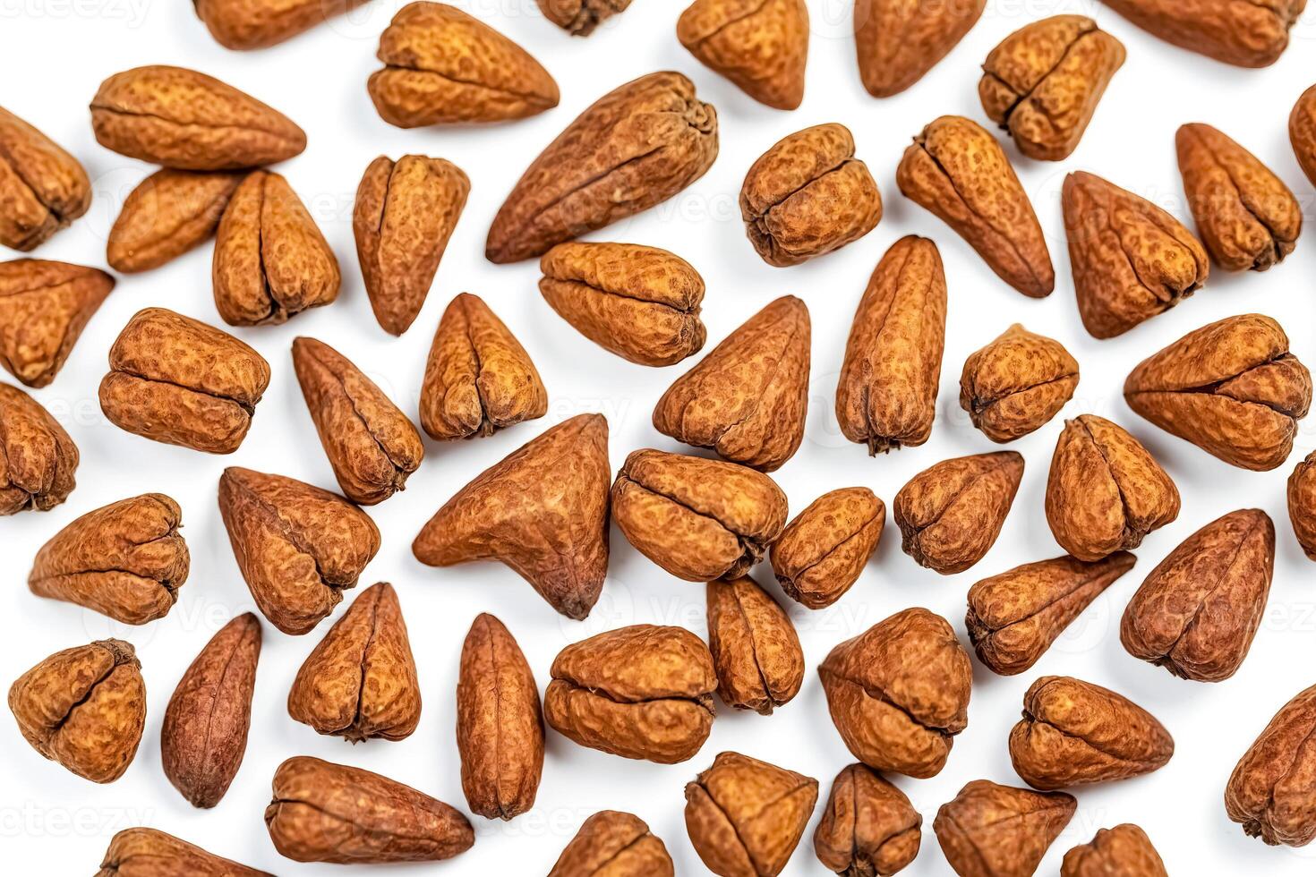 Close-up of brown seeds isolated on white background photo