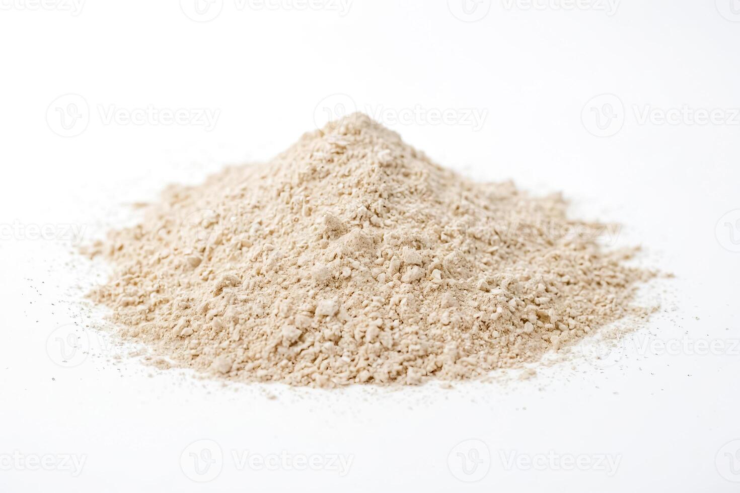 Close-up of a pile of oat flour on a white background photo