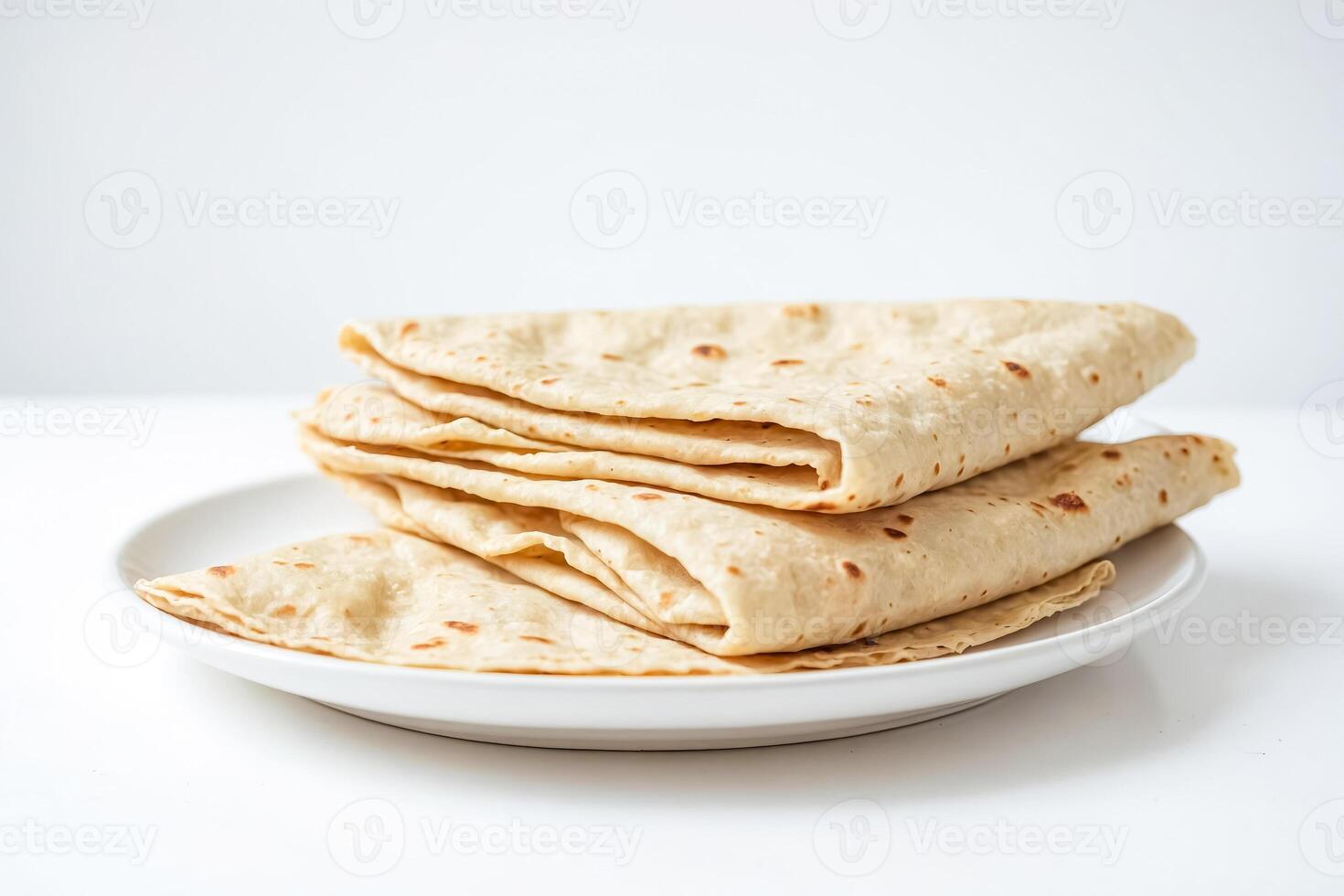 Stack of Tortillas on White Plate photo