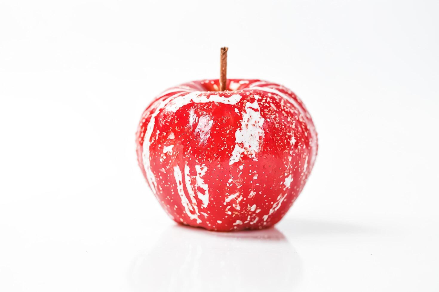 Red apple with white stripes isolated on white background photo