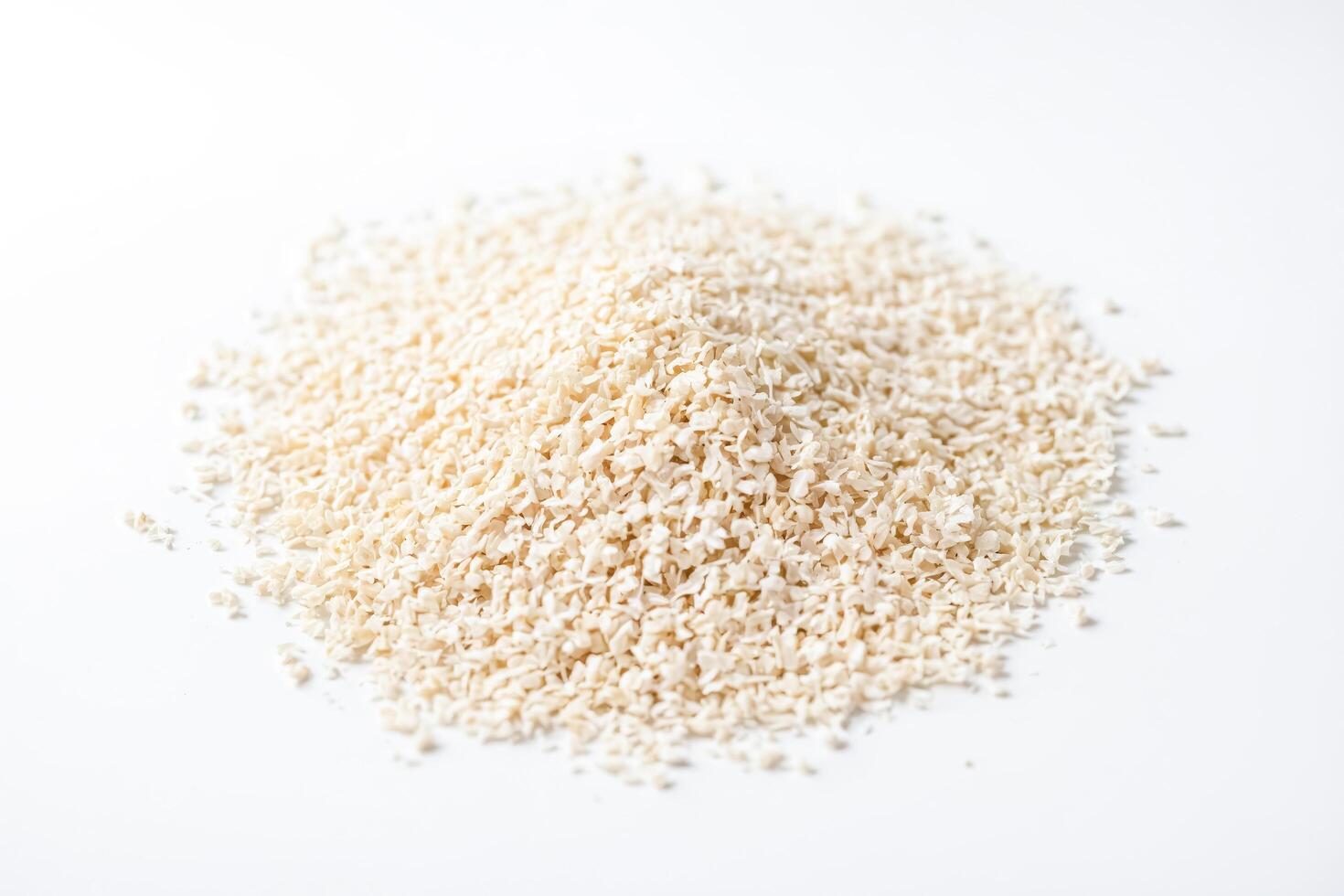 Dried Onion Flakes on White Background photo