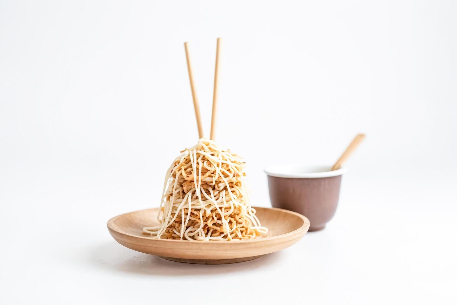 Instant Noodles on Wooden Plate with Chopsticks photo