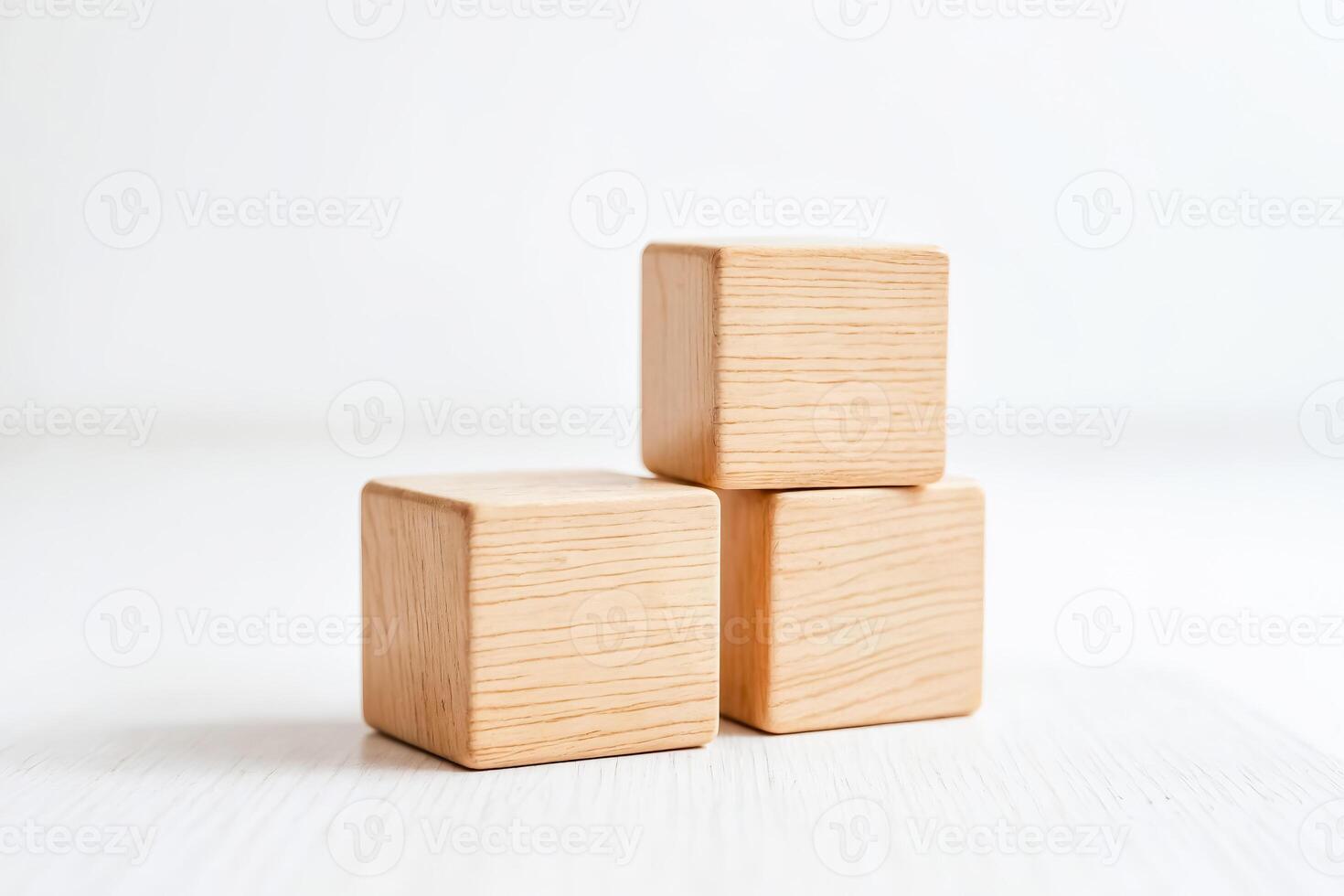 Three Wooden Blocks on White Surface photo