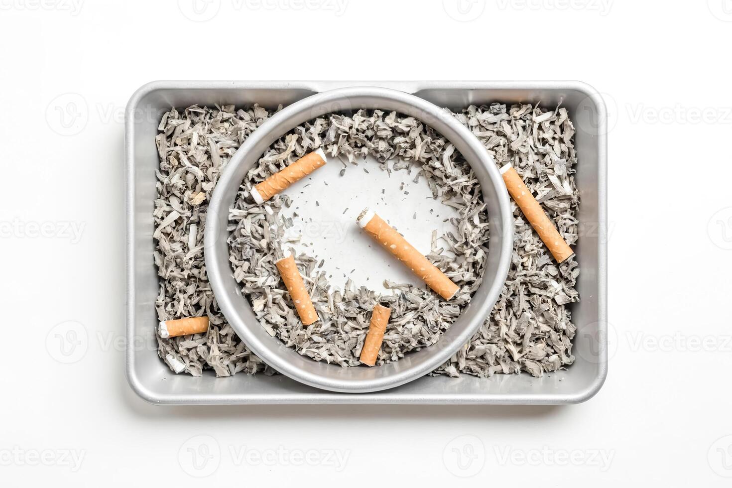 Close-up of a full ashtray with cigarette butts photo