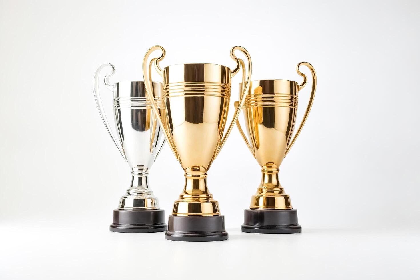 Gold and Silver Trophy Cups on White Background photo