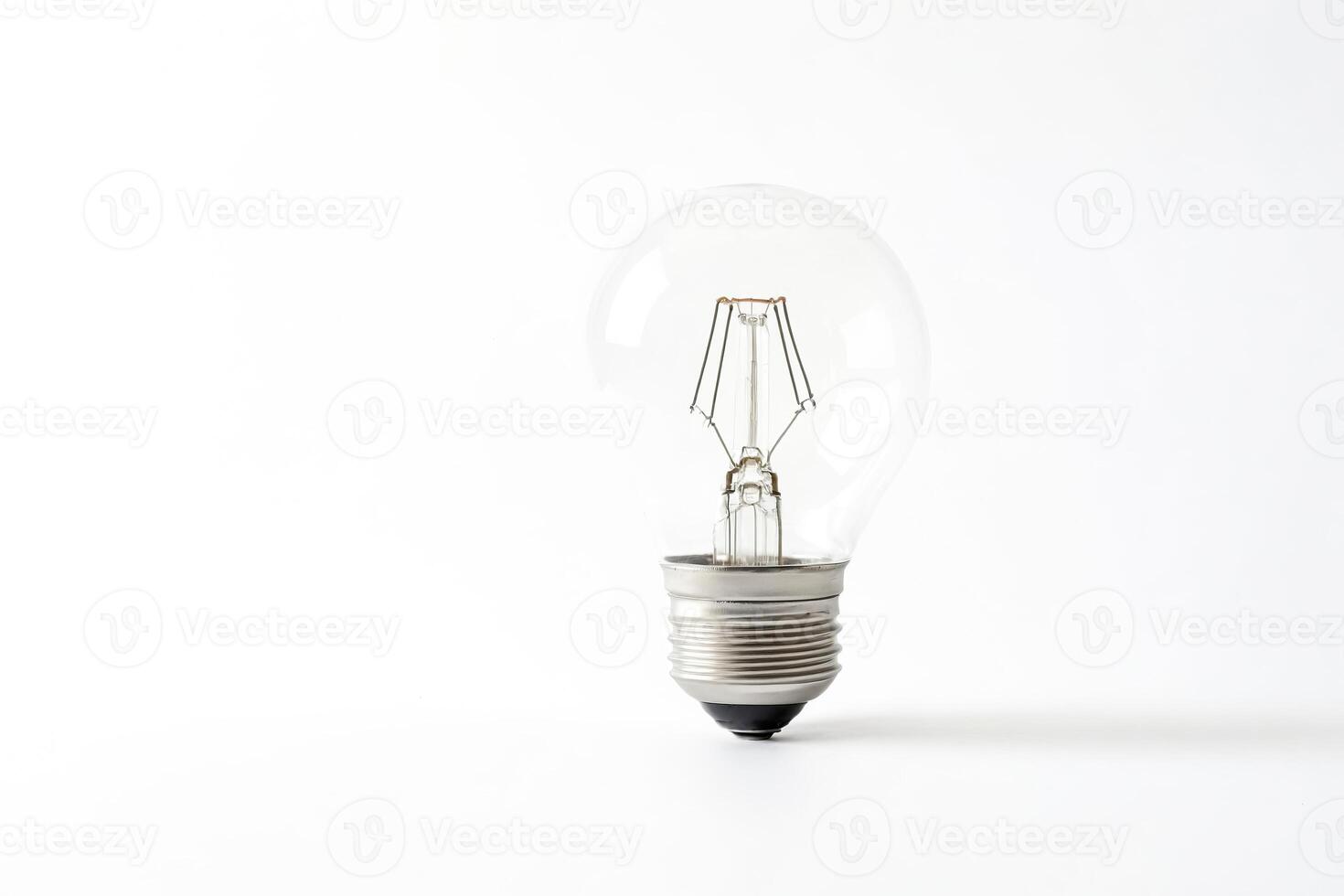 Clear lightbulb isolated on white background photo