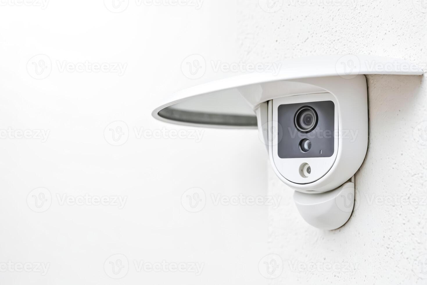 Security Camera Mounted on Building Wall photo