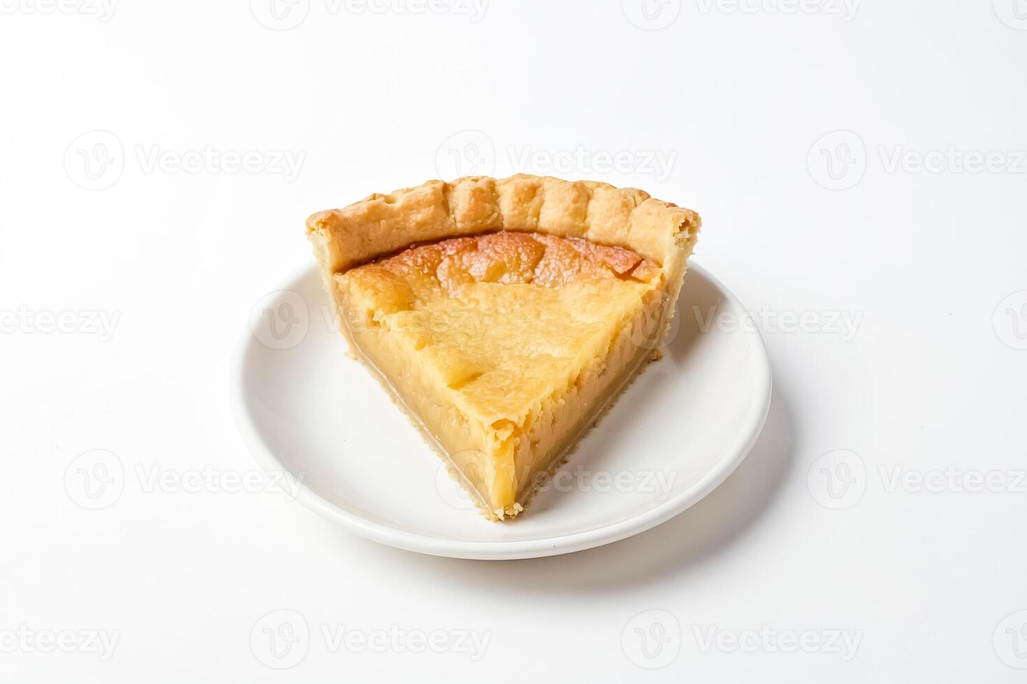 Slice of Butterscotch Pie on a White Plate photo