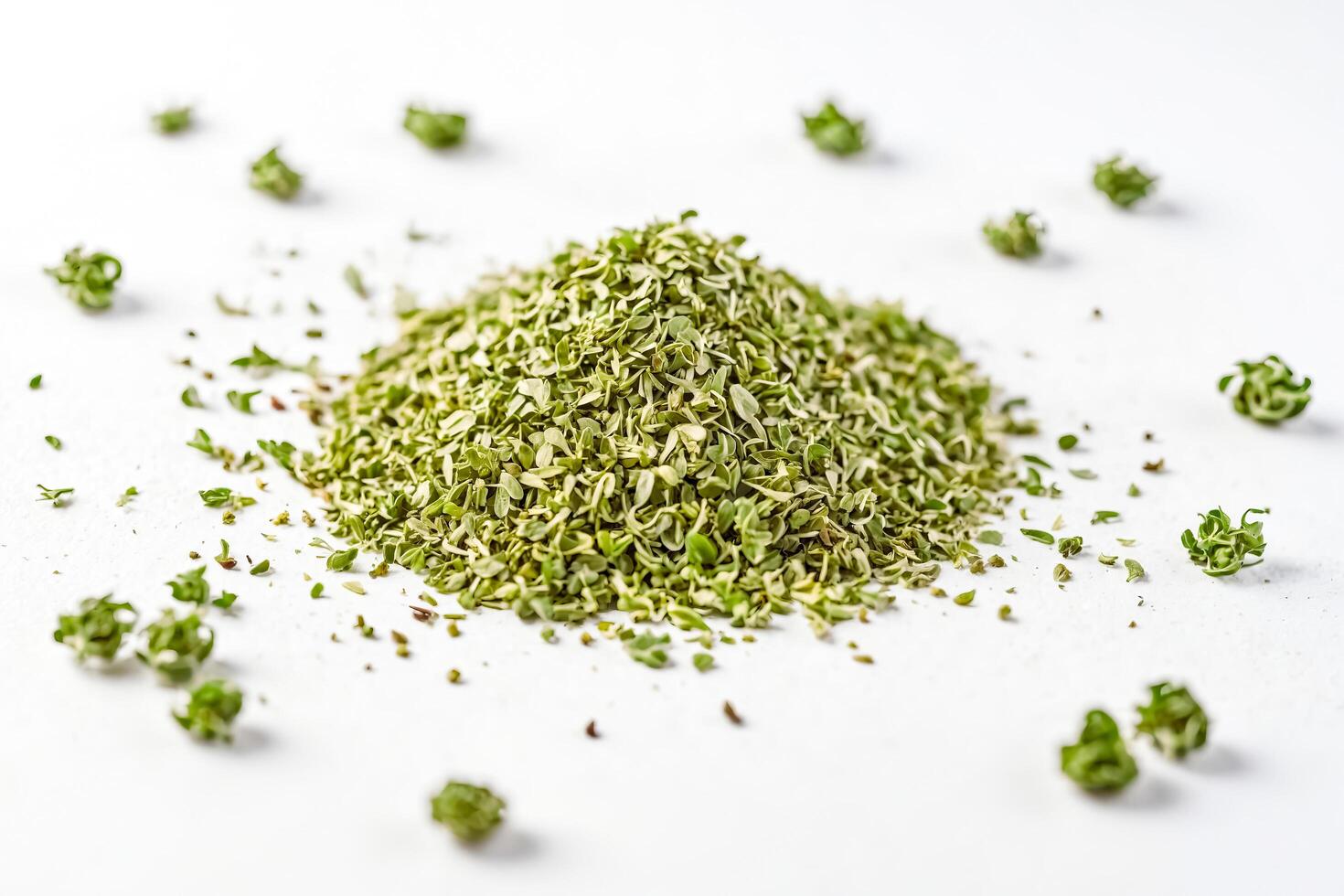 Dried oregano leaves on white background photo