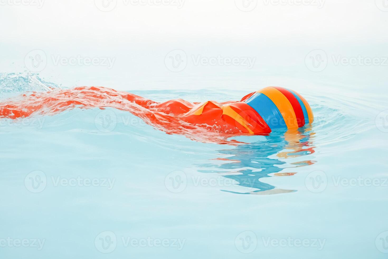 Colorful Inflatable Ring Floating in Pool photo