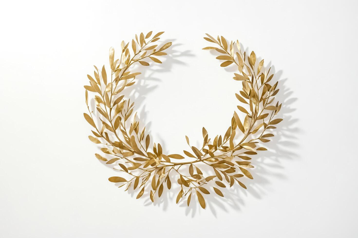 Golden leaves wreath on white background photo