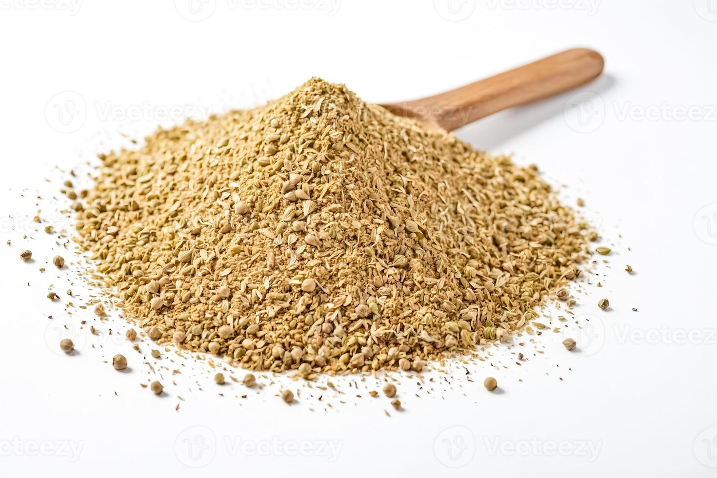 Heap of coriander seeds and wooden spoon photo