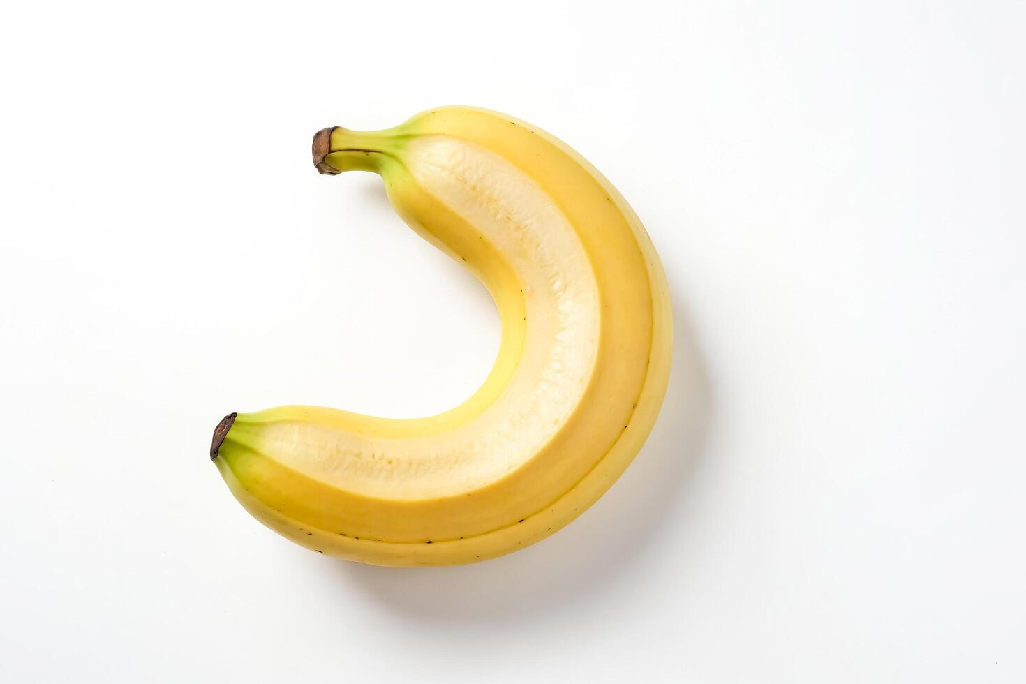 Single peeled banana on white background photo