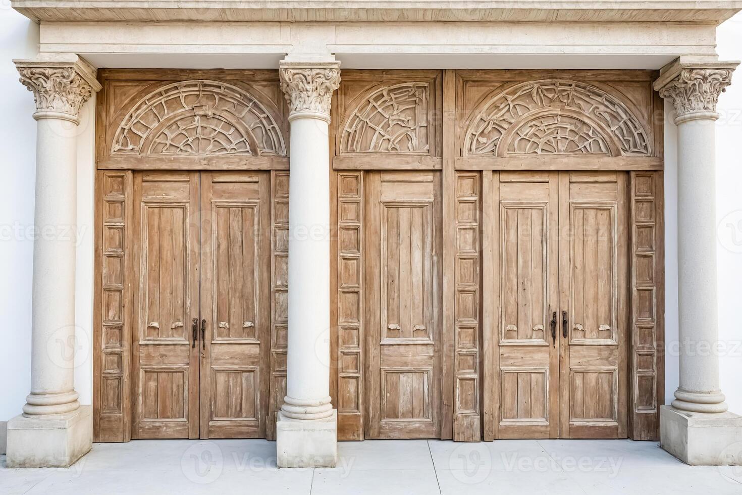 Three Ornate Wooden Doors with Columns photo