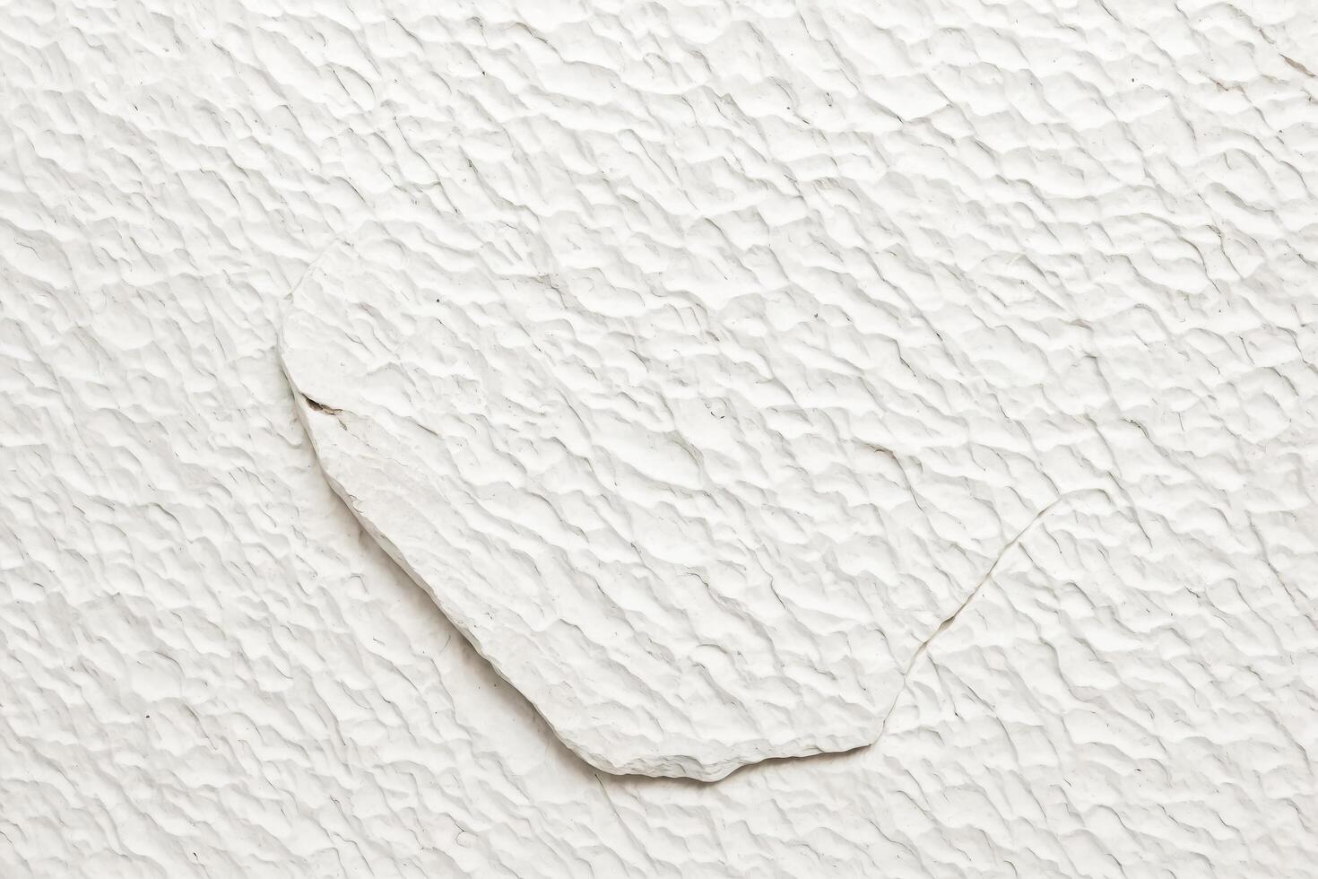 White Textured Wall with a Unique Shape photo
