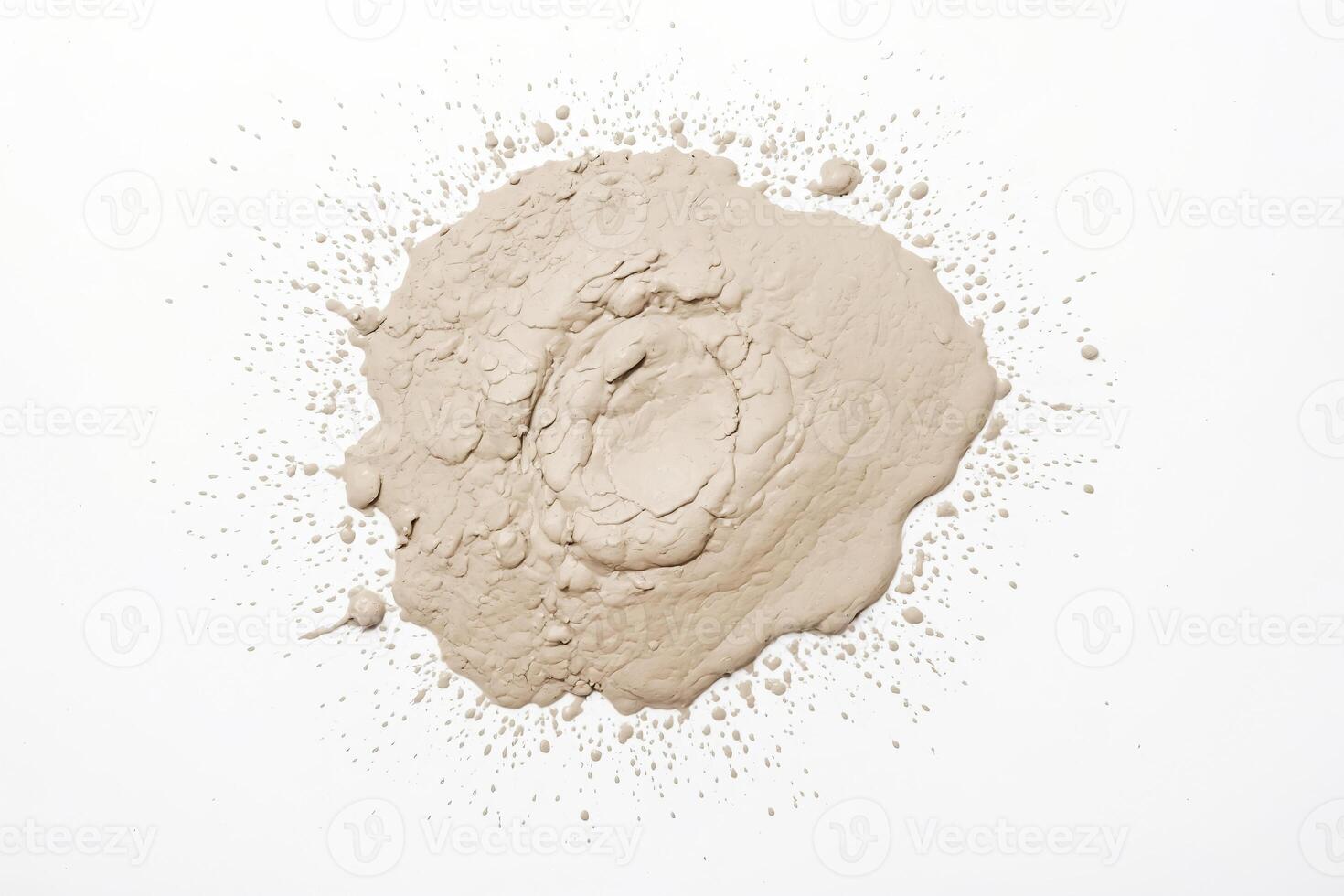 Beige paint splattered on a white background photo