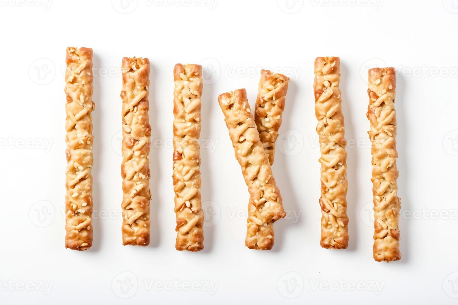 Sesame Seed and Peanut Bread Sticks on White Background photo