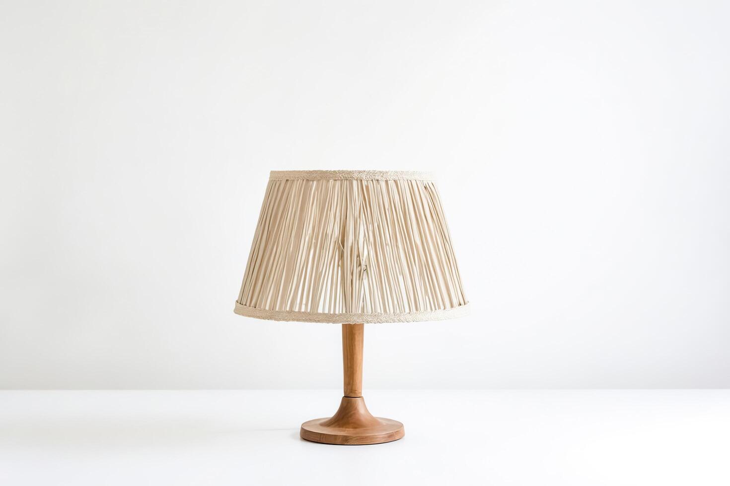 Table Lamp With Beige Shade And Wooden Base photo