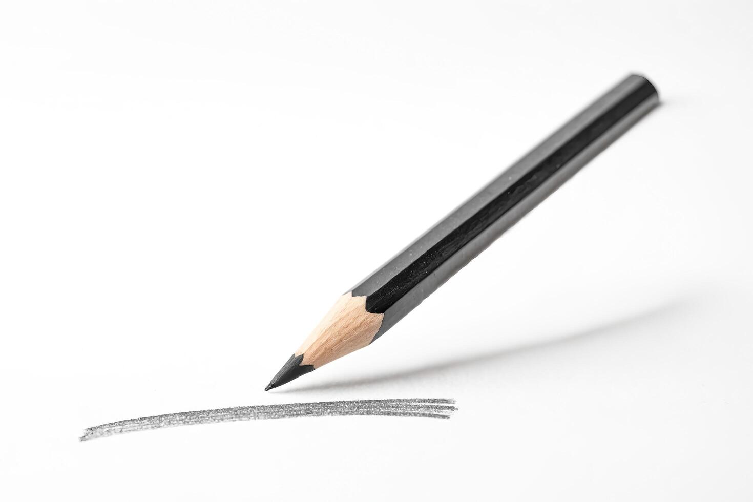 Black Pencil Drawing Line On White Paper photo