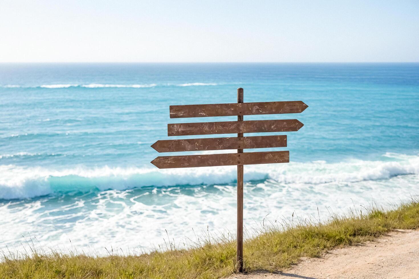 Wooden signpost with ocean view photo
