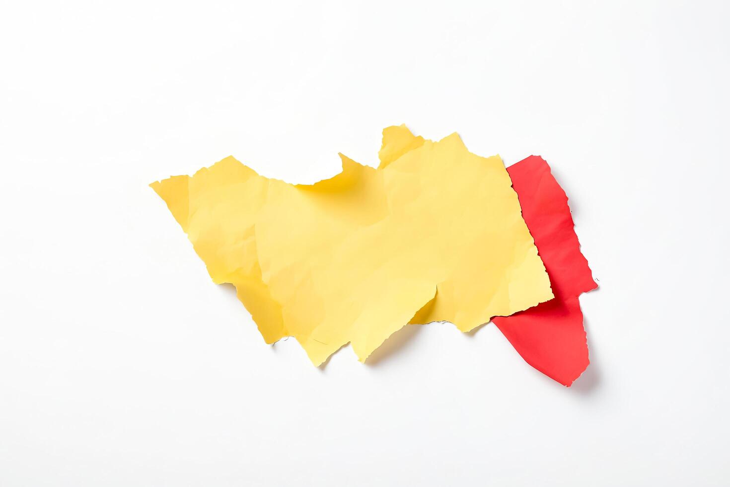 Yellow and red ripped paper on white background photo