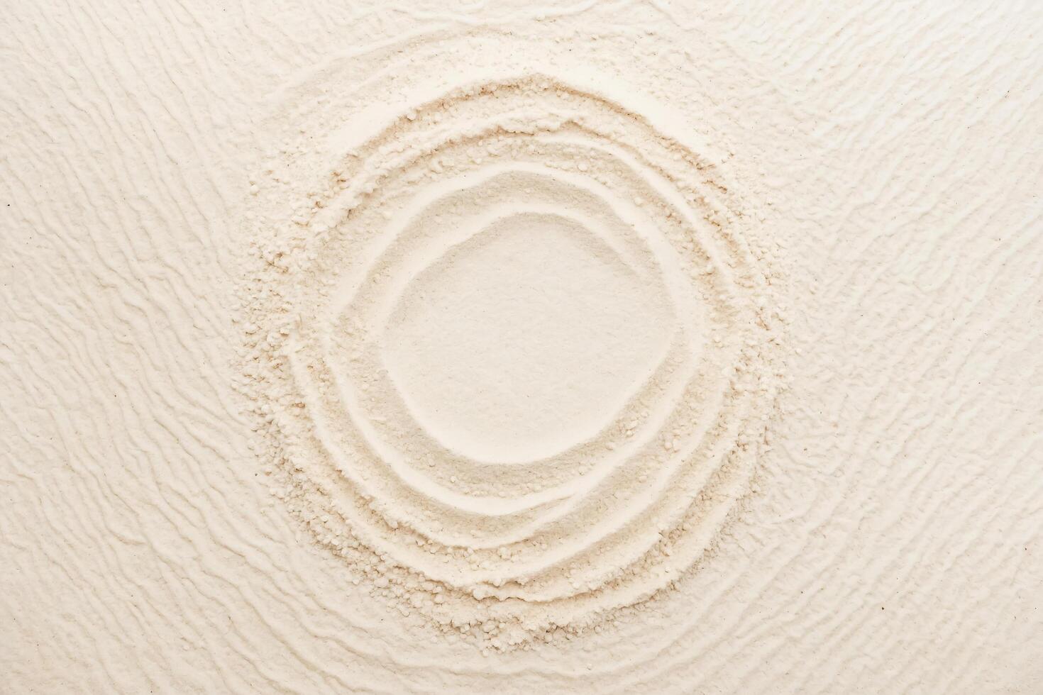 Circular Pattern on White Sand photo