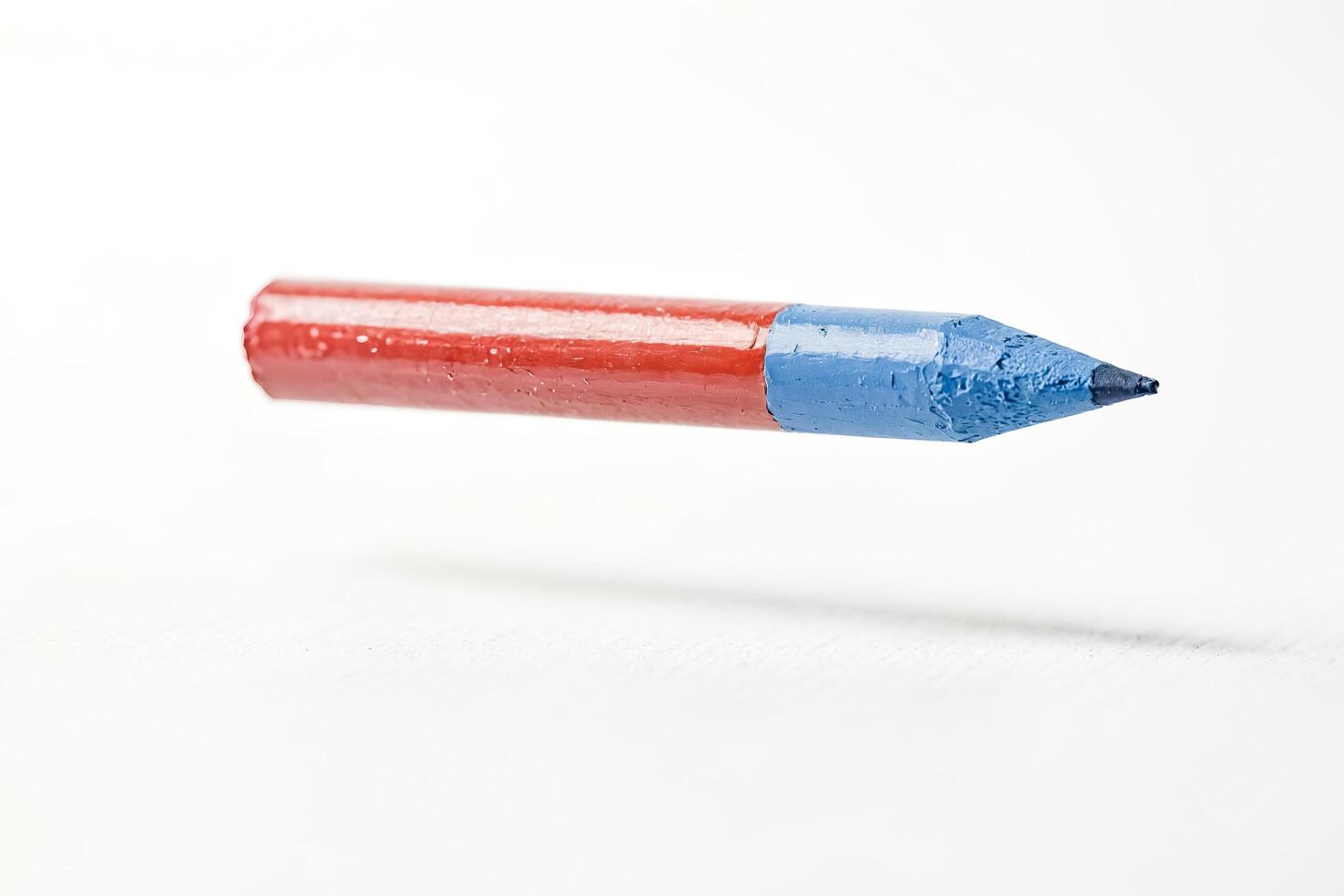 Red and Blue Pencil Floating in the Air photo