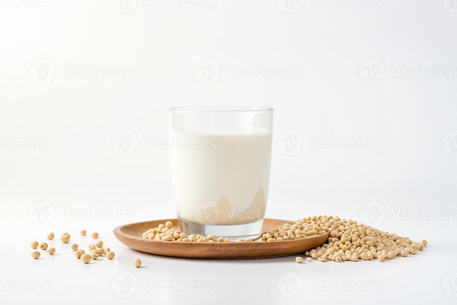 Soy Milk in Glass with Soybeans on Wooden Plate photo