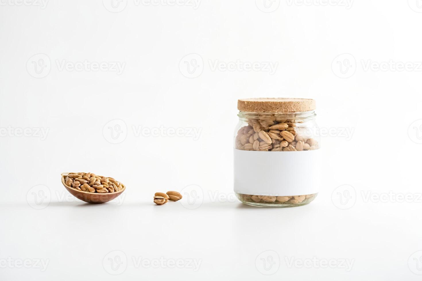 Glass Jar with White Label and Brown Beans on White Background photo