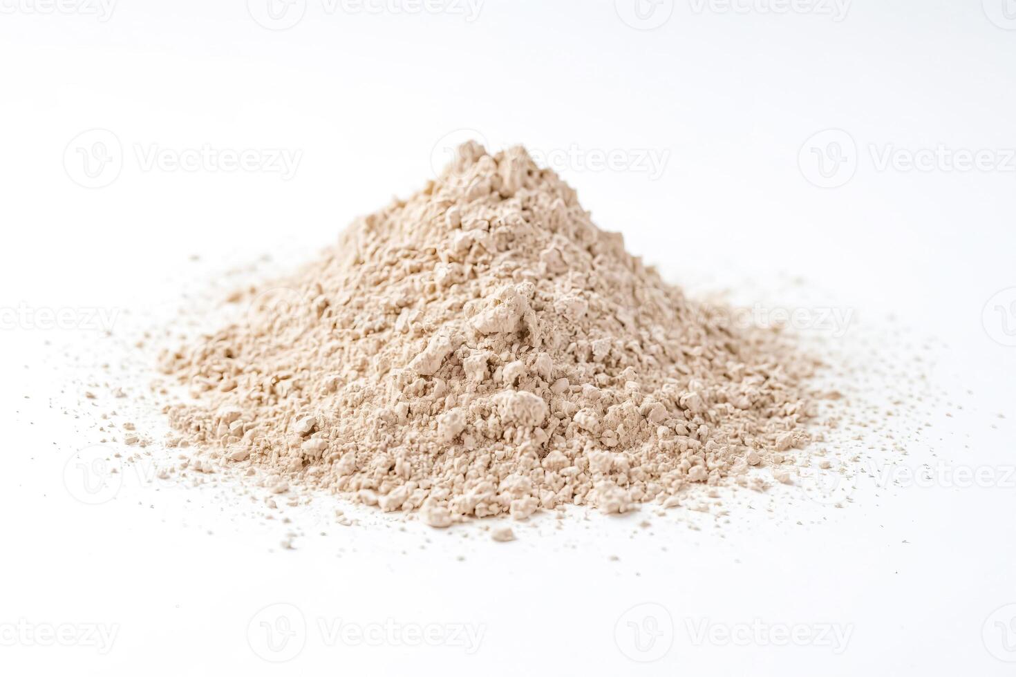 Pile of fine beige powder isolated on white background photo