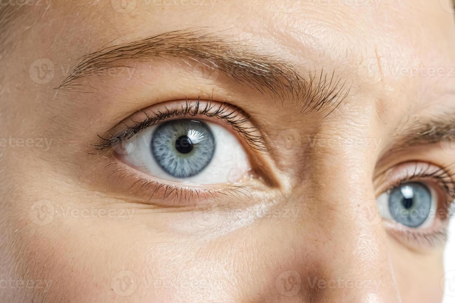 Close-up of a blue eye with long eyelashes photo
