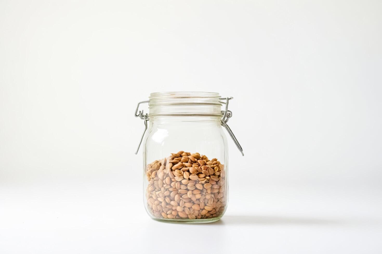 Glass Jar Filled with Brown Seeds photo
