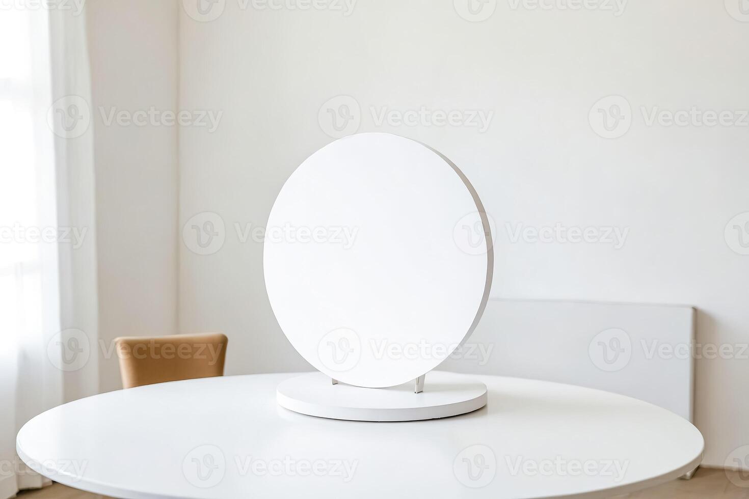 White Round Table With a Blank Round Sign photo