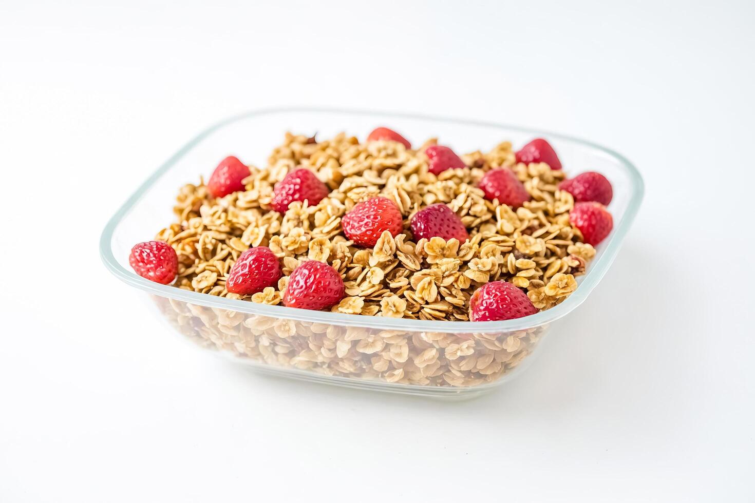 Granola with Strawberries in Glass Bowl photo