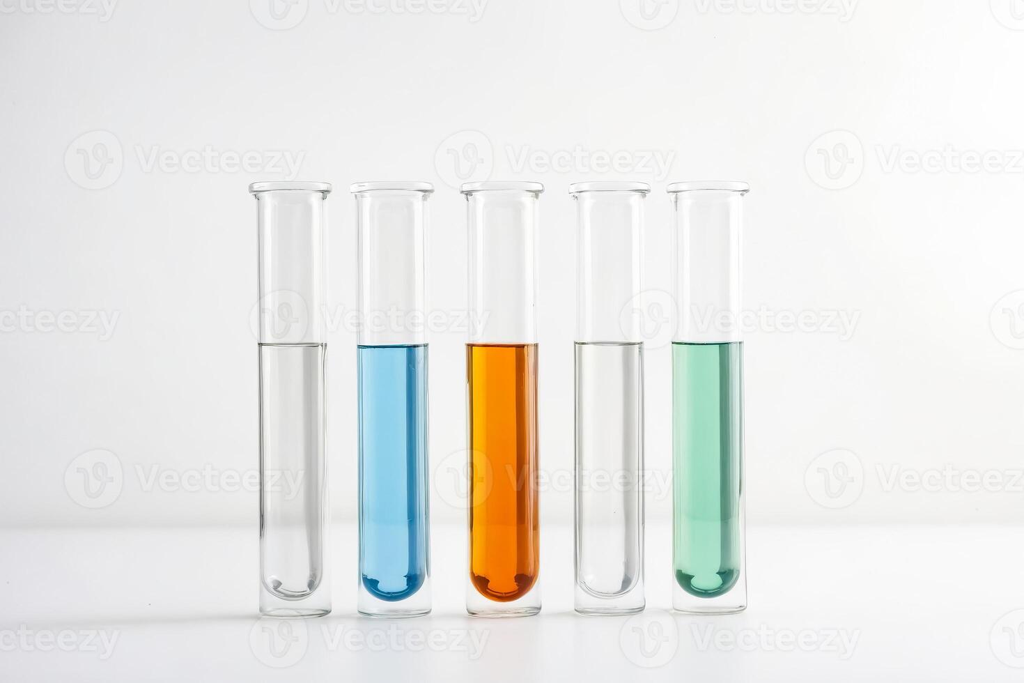 Colorful liquids in test tubes on white background photo