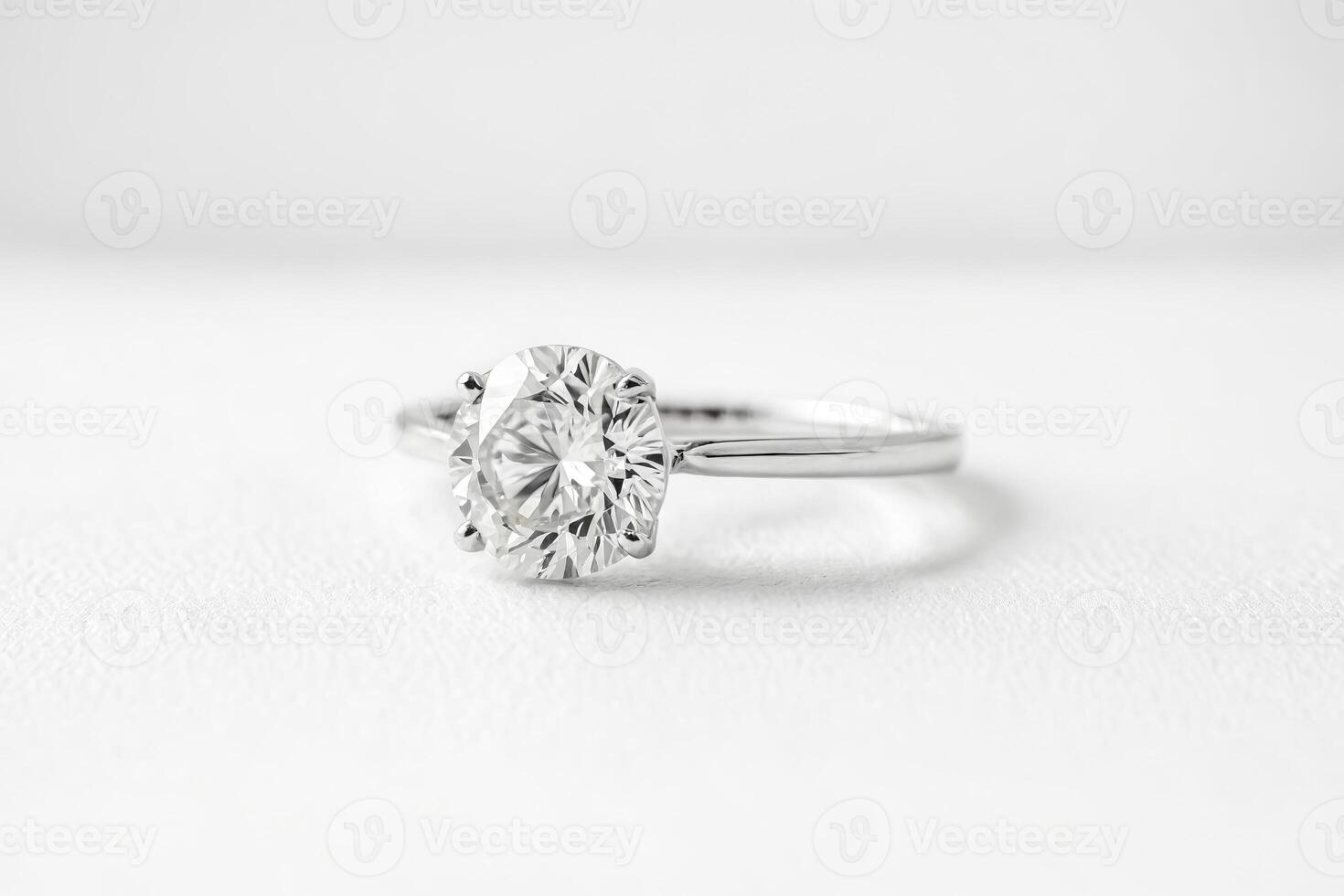 Close-up of Diamond Ring on White Surface photo