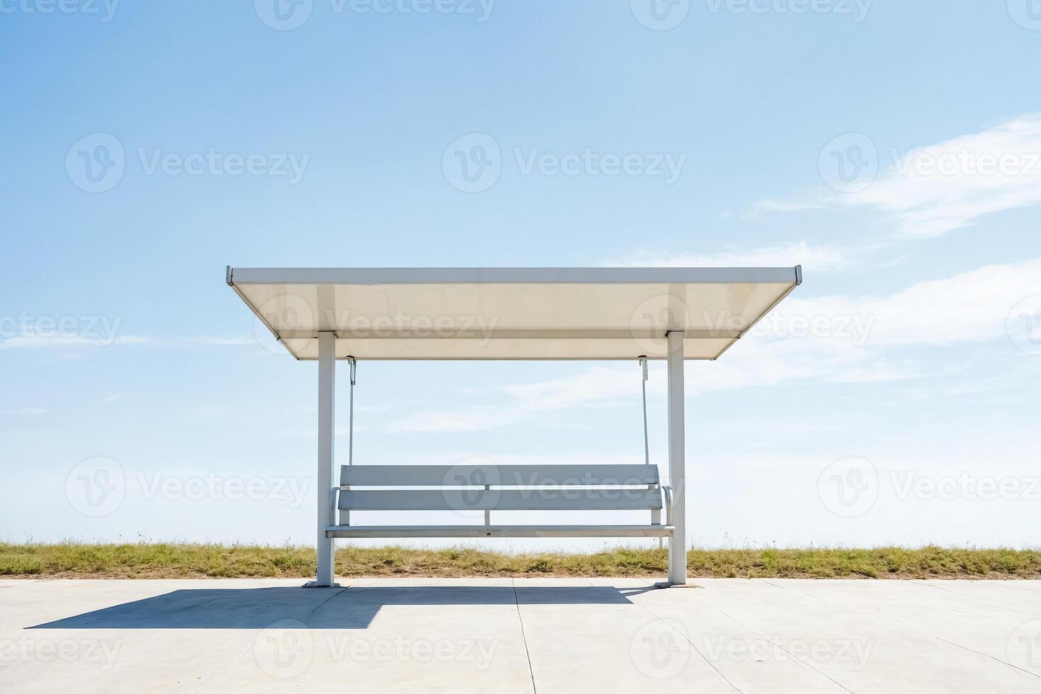 Minimalist white bench with a roof on a concrete platform photo