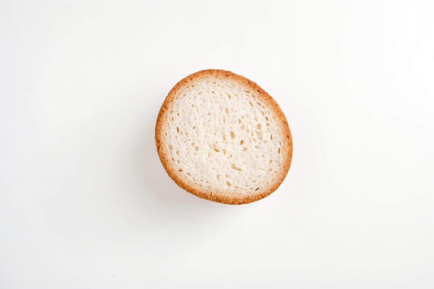 Close-up of a Single Round Bun with Crispy Crust photo