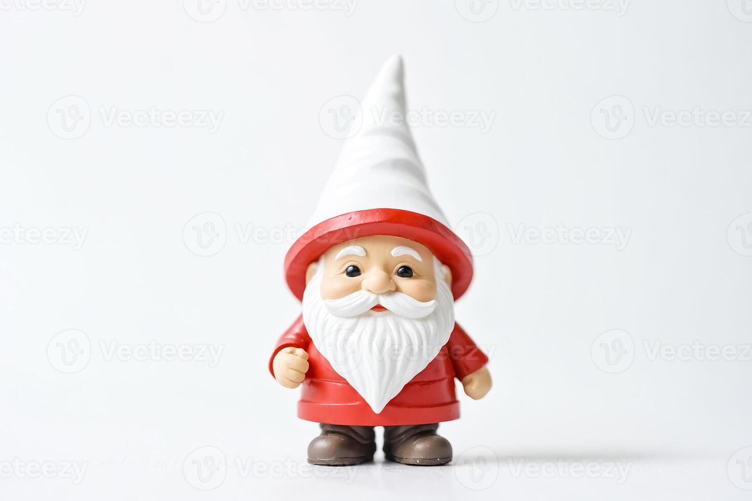 Festive Garden Gnome with a White Beard and Red Hat photo