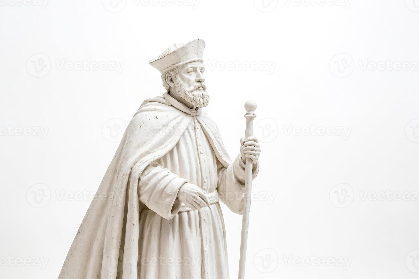 White Statue of a Man with a Staff photo
