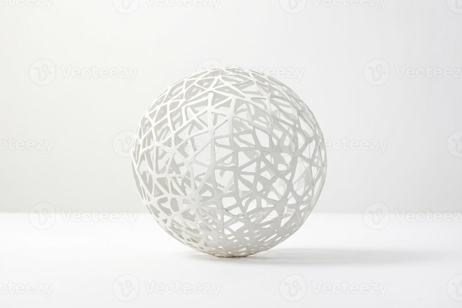White geometric sphere with intricate pattern photo