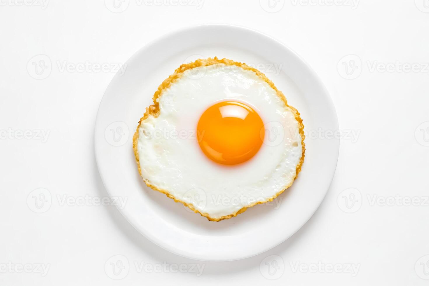 Close-up of a Fried Egg on a White Plate photo