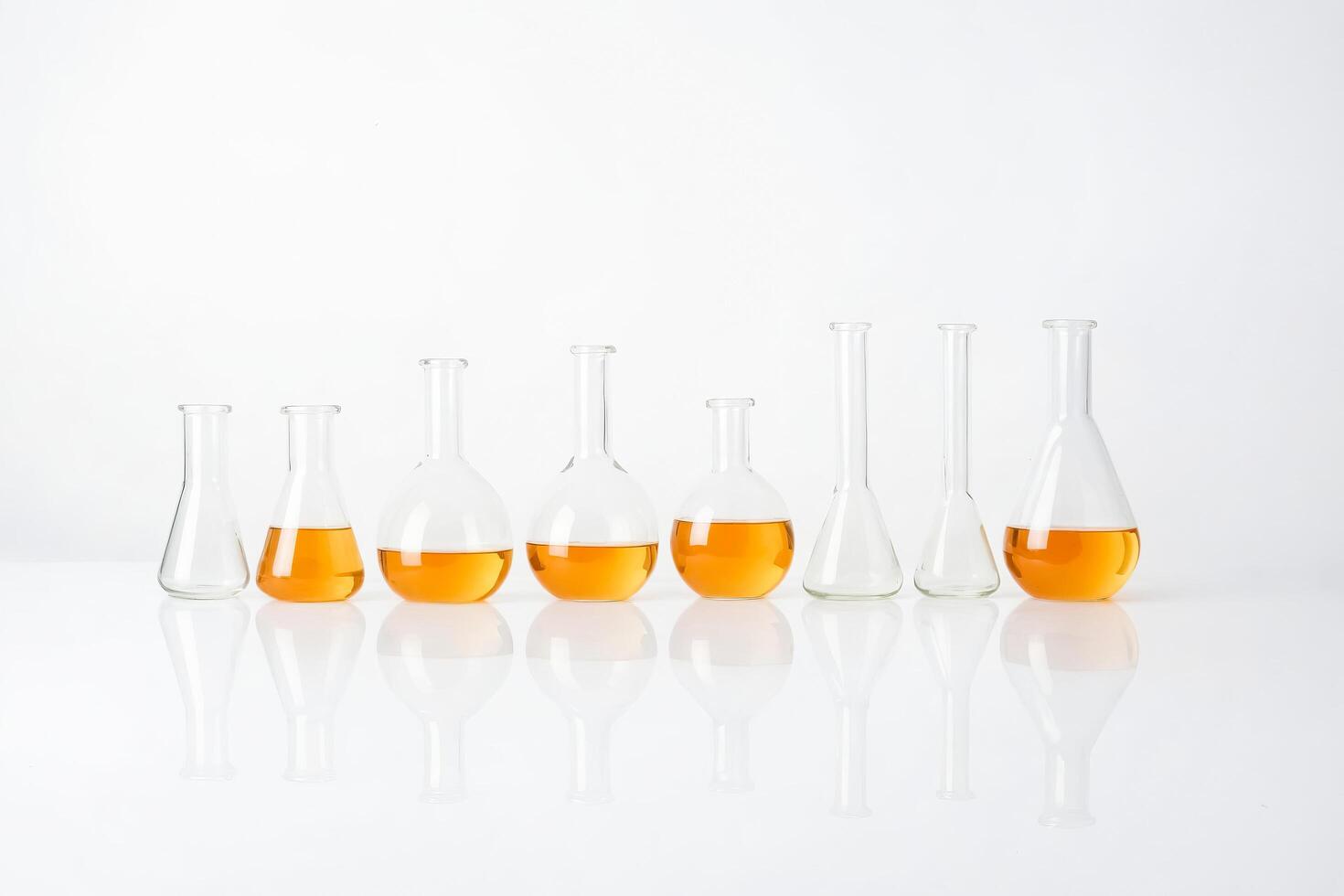 Glass Beakers With Orange Liquid photo