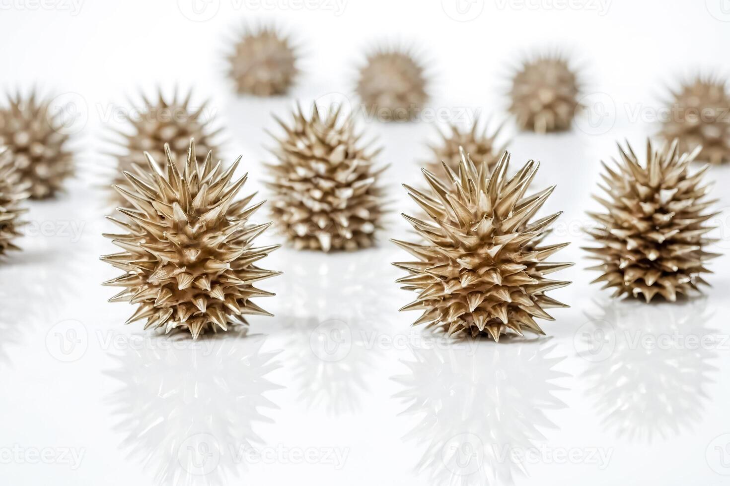 Golden Spiky Objects on White Background photo