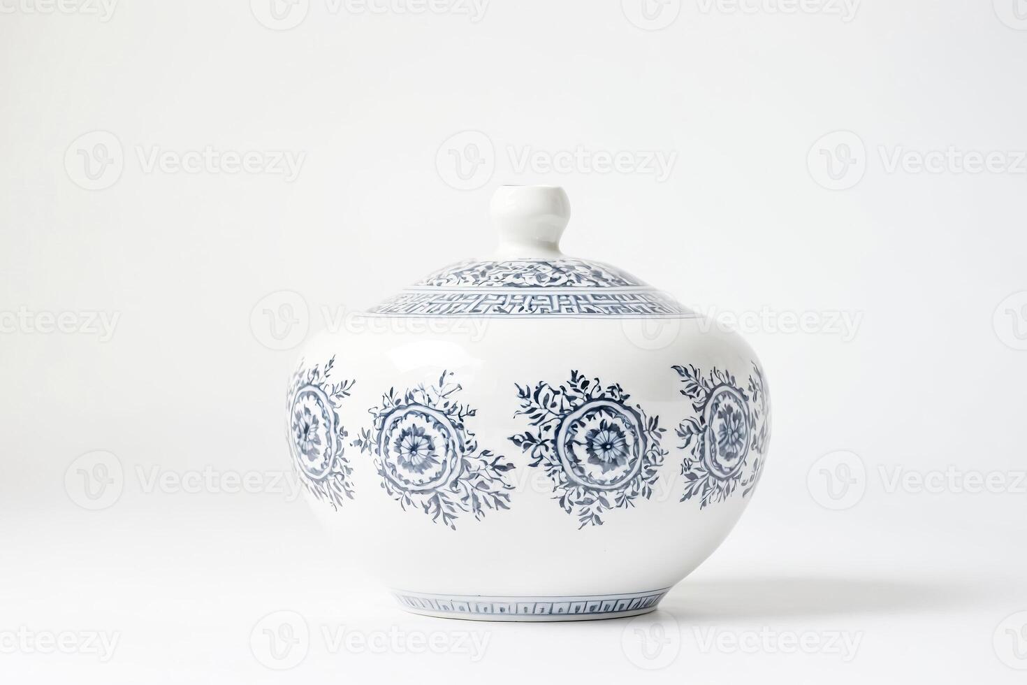 White and Blue Porcelain Vase with Floral Pattern photo